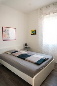 a bedroom with a large bed in a room at Casa Mirella in Cavallino-Treporti