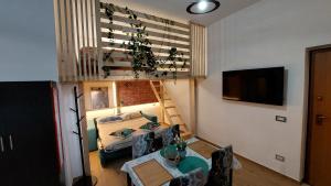 a living room with a couch and a table at Rosa Room in Castelnuovo Cilento