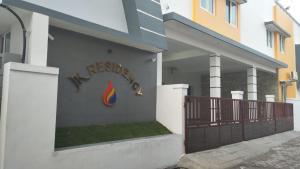 a building with a sign on the side of it at JK Residency in Virudunagar