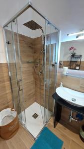 a bathroom with a shower and a sink at Rosa Room in Castelnuovo Cilento +53 photos