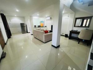 a large living room with a couch and a table at Palmyra resort in Jaffna