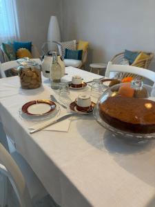 a table with a bowl of food on it at B&B Le Saline Bed & Breakfast in Cervia +41 photos