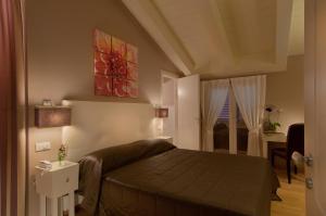 חדר ב-Hotel Arnolfo & Aqua Laetitia Spa & Beauty