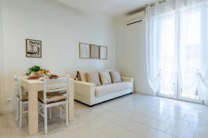 a living room with a couch and a table at Maison di Andrea in Zibido San Giacomo