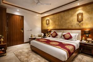 a bedroom with a large bed in a room at Velocity Corporate Hotel TERMINAL 2,3 Delhi Airport With- Free Airport Pickup in New Delhi