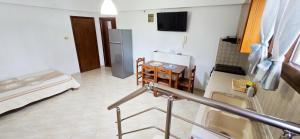 Un televizor și/sau centru de divertisment la Anna Rooms