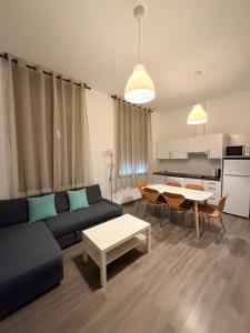 a living room with a couch and a table at Zerka Sendra in Valencia