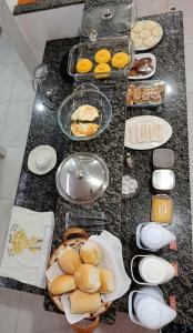 a table with a bunch of food on it at Pousada Novo Millenium in Araripina