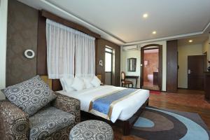 Uma cama ou camas num quarto em Dahlia Boutique Hotel