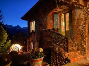 a house with a staircase in front of it at night at Casa toscana in Thun