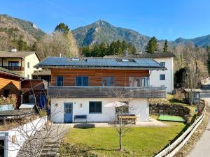 a house with solar panels on top of it at Ein Haus am Berg in Marquartstein