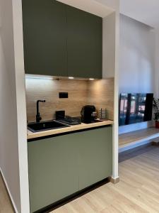 a kitchen with a sink and a counter top at Nido Estivo 2 in Nea Skioni