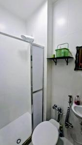 a bathroom with a shower and a toilet and a sink at Studio Catete Flamengo in Rio de Janeiro +15 photos