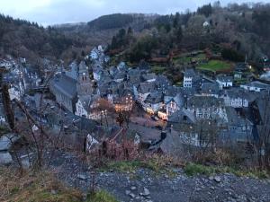 a town on a hill with houses and lights at Ferienwohnung Grünes Leben in Simmerath