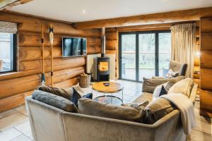 a living room with a couch and a table at The Lookout in Ilkley