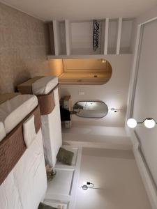 a small room with two bunk beds in it at Bodini Apartments in Laganas