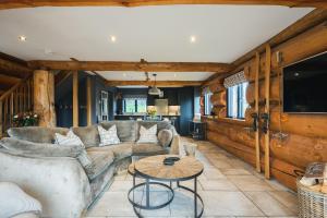 a living room with a couch and a table at Apres Ski in Ilkley