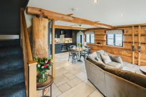 a living room with a couch and a table at Apres Ski in Ilkley