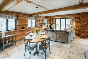 a living room with a table and a couch at Apres Ski in Ilkley +22 photos