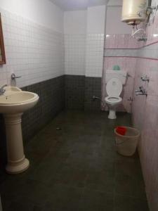 a bathroom with a sink and a toilet at Hotel Kailash View, Kalpa in Kalpa +23 photos