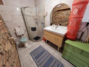 a bathroom with a sink and a shower at Mandula Apartman in Szeged +28 photos