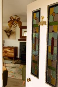 a room with a door with stained glass at Evrabister, Shetland Islands in Mainland