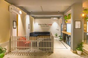 a lobby with a sign that says stay in the loop at Loop by Zolo Baani Square, Gurugram in Gurgaon