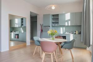 a kitchen and dining room with a table and chairs at Key Inn serviced residences Belair in Luxembourg +46 photos