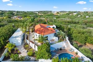 an aerial view of a house with an orange roof at Saint Joris a tiny Boutique Resort in Willemstad