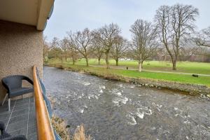 a view of a river from a balcony at Riverside Park 3 in Keswick
