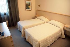 Postel nebo postele na pokoji v ubytování Hotel Bassetto