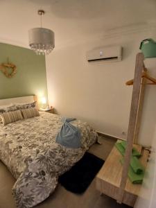 a bedroom with a bed and a ladder at RJ Summer in Sagres +17 photos
