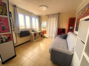 a bedroom with a bed and a television in it at Attico Sant'Anna - Silent Bay Apartments in Sestri Levante