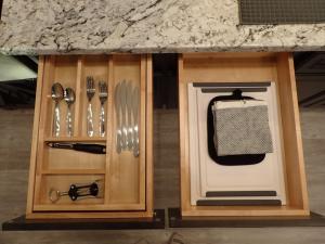 a kitchen with a counter with knives and utensils at Private White Mountains Guest Suite - Welcome! in Littleton