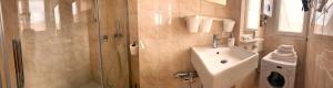 a bathroom with a shower and a sink at Attico Sant'Anna - Silent Bay Apartments in Sestri Levante