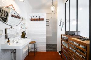 a bathroom with a sink and a mirror at Maison Nice - Plage 300m - Parking in Nice +60 photos