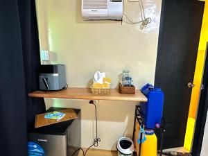 a small table in a room with a heater and aether at El Nido's View in El Nido +16 photos