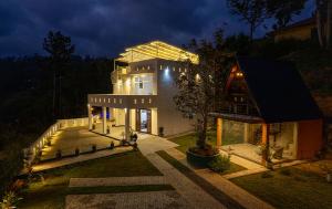 a large house at night with its lights on at Green Infinity Resort in Diyatalawa