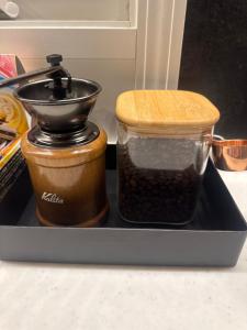 two containers of food sitting on a black tray at BIEI TERRACE 2nd Floor - 2F専用独立玄関 - 2F占有127平米2LDK - 大型バスルーム, 85型スマートTV, 無料Wi-Fi -駅前通り景観条例指定地区 in Biei +46 photos