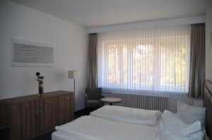 Postel nebo postele na pokoji v ubytování Gästehaus Pauline
