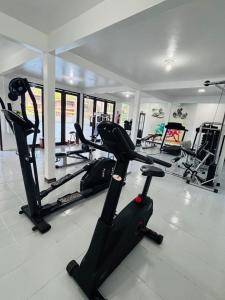 a gym with treadmills and elliptical machines at Ceta Ecotel in Macapá