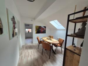 a dining room with a table and chairs at Casa-Mandelartz in Rees