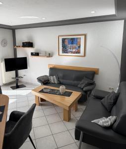 a living room with a couch and a table at Ferienwohnung Pellenz in Bremm