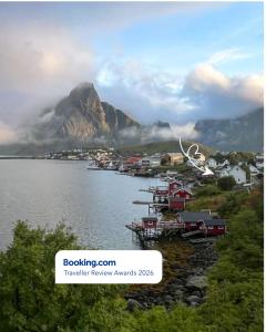 a view of a body of water with a mountain at Husly Reine - your home with Reinebringen view in Reine
