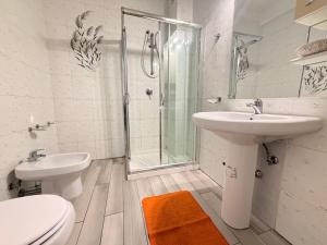 a bathroom with a toilet and a sink and a shower at La Piccola Dimora Sul Mare in Gallipoli