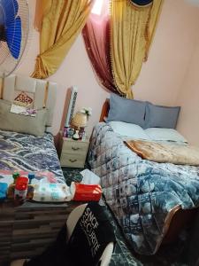 a bedroom with two twin beds next to each other at Sidi boulfdyl in Tiznit