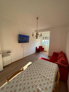 a bedroom with a bed and a couch at Casa Nora in Trieste