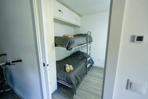 a room with two bunk beds in a room at Mountain Home in La Pinilla