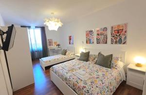 a bedroom with a bed and a tv in it at Il Podestà in Fabriano