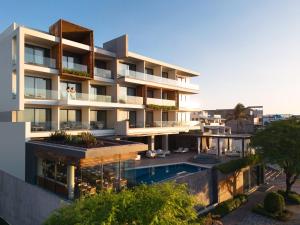 an image of a building with a swimming pool at Hotel Indigo - Galapagos by IHG in Puerto Baquerizo Moreno